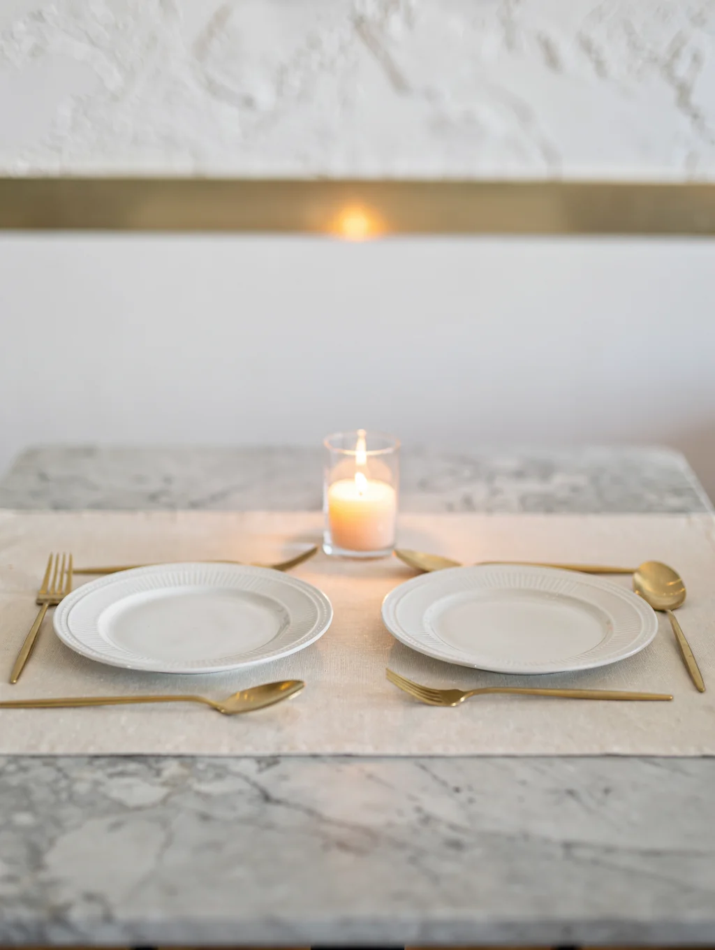 Elegant table setting with ceramic plates and warm lighting